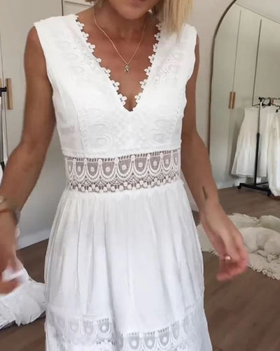 Sleeveless lace dress with V-neckline